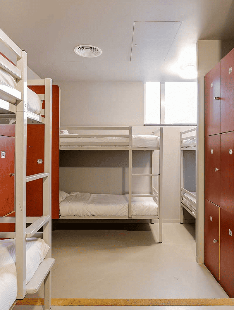 Bunk beds and lockers in a dorm room at ClinkNOORD hostel in Amsterdam