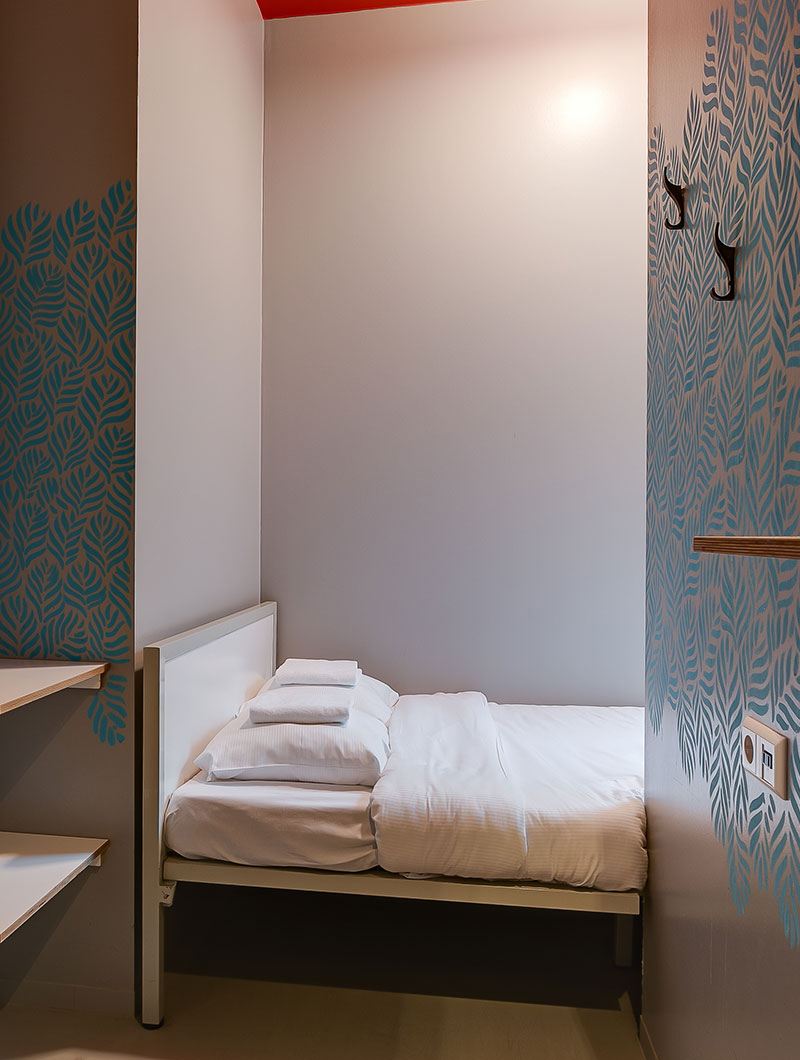 A private double room at ClinkNOORD hostel in Amsterdam with a double bed