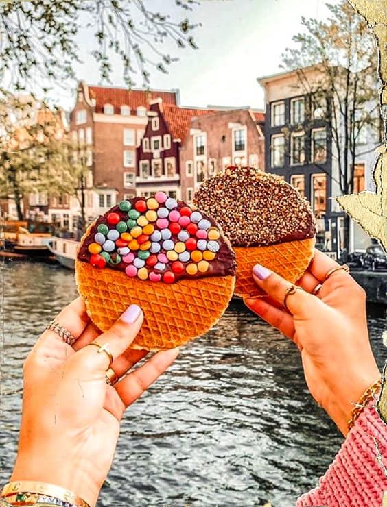 people enjoying traditional Dutch snacks in the city of Amsterdam