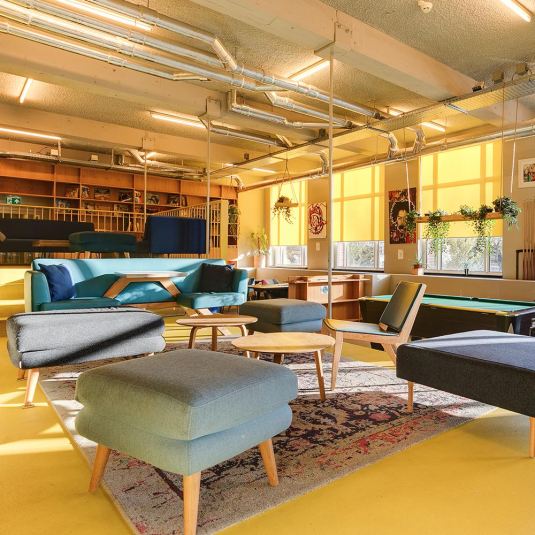 a social space and seating area at ClinkNOORD hostel in Amsterdam