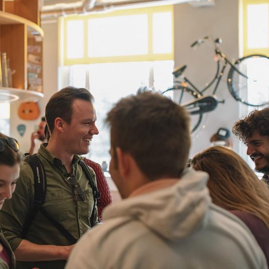 Student group meets in reception of Clinknoord Amsterdam