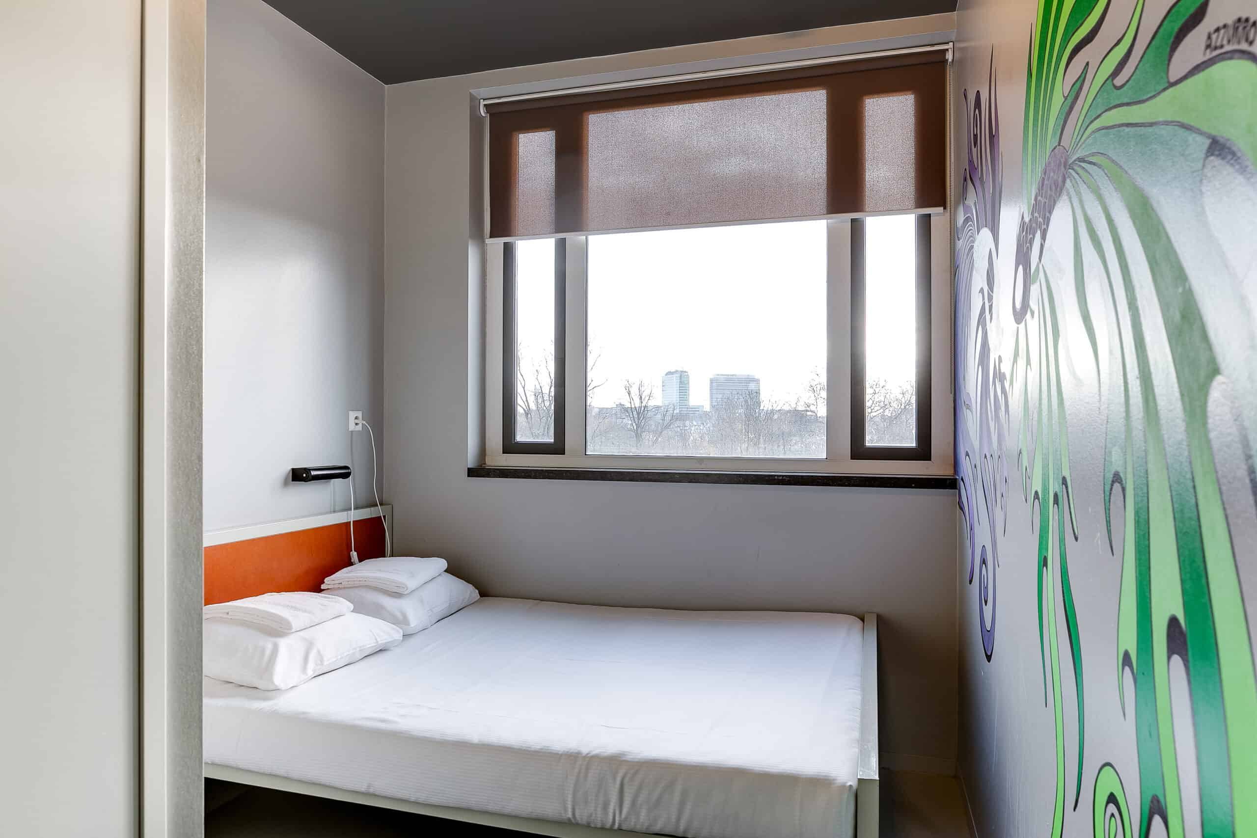 Private room double bed at Clinknoord hostel Amsterdam