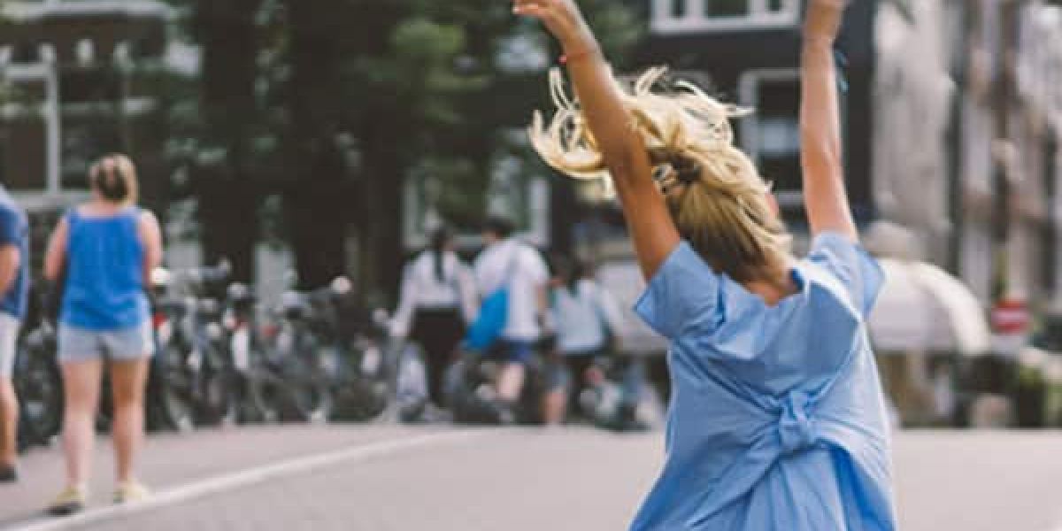 a tourist embracing their time in amsterdam