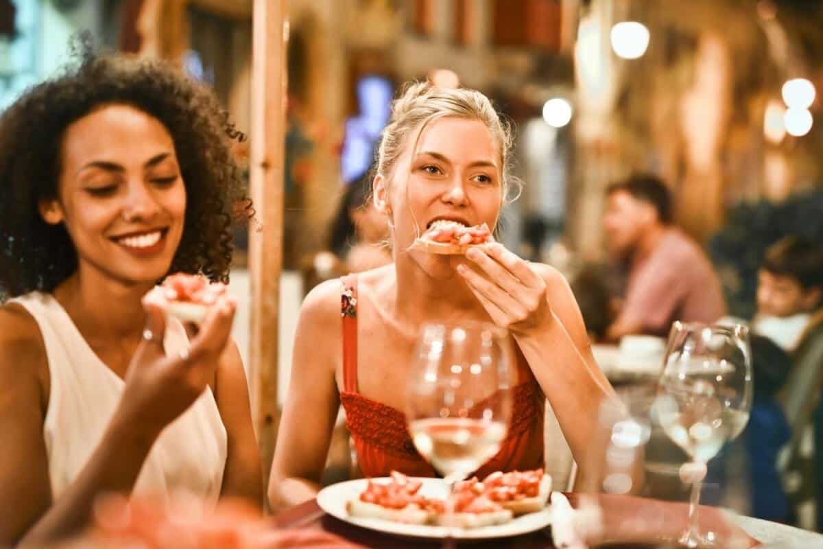 2 women having pizza at a restaurant
