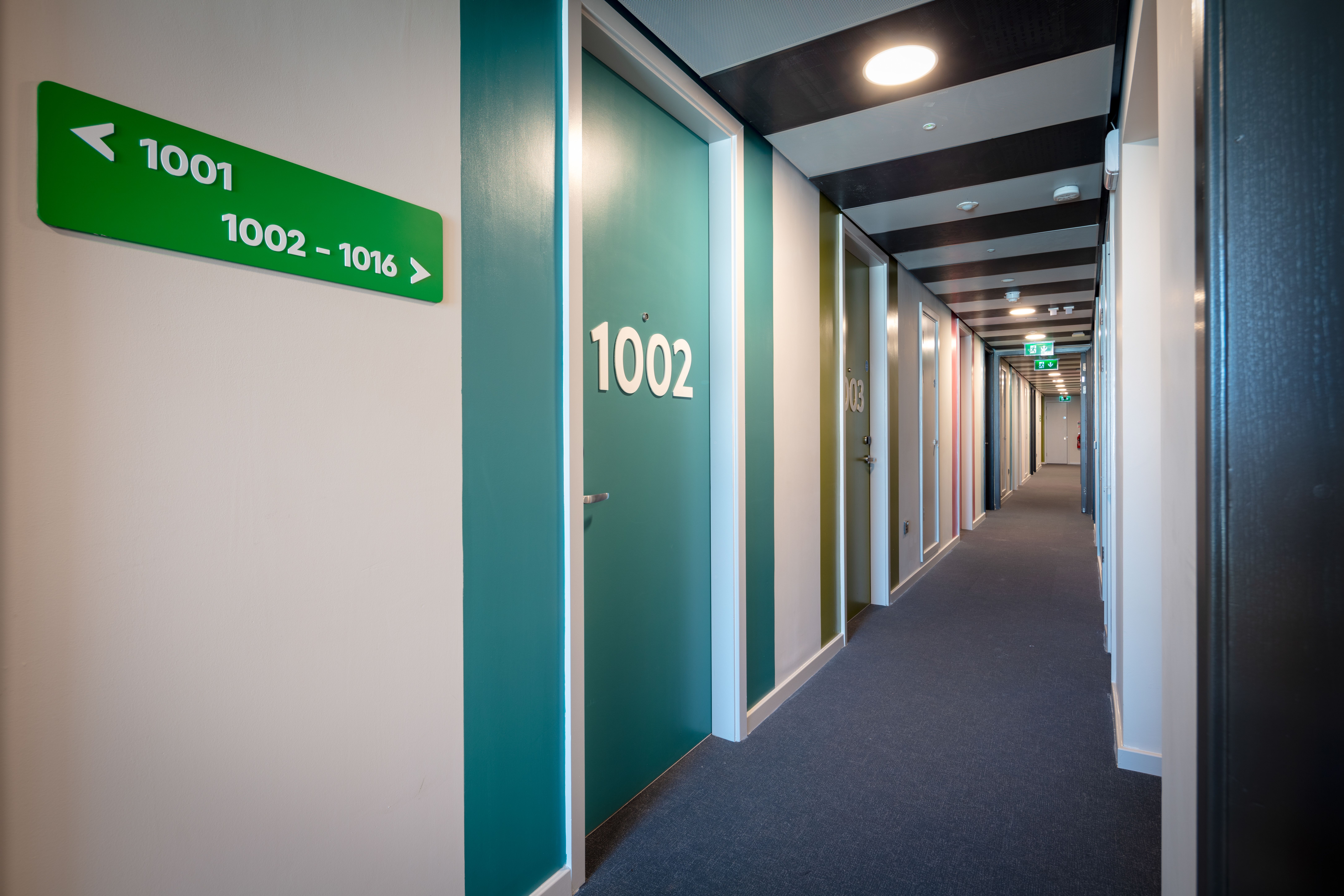 Clink i Lar hostel corridor and room signs