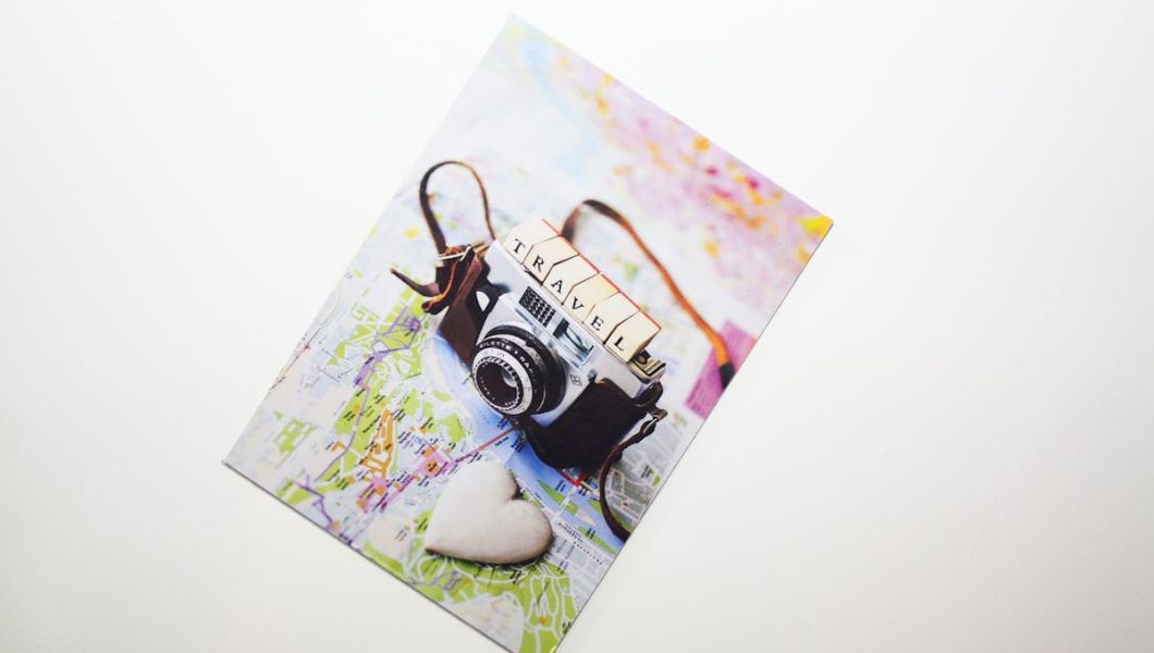 Postcard with a camera on it