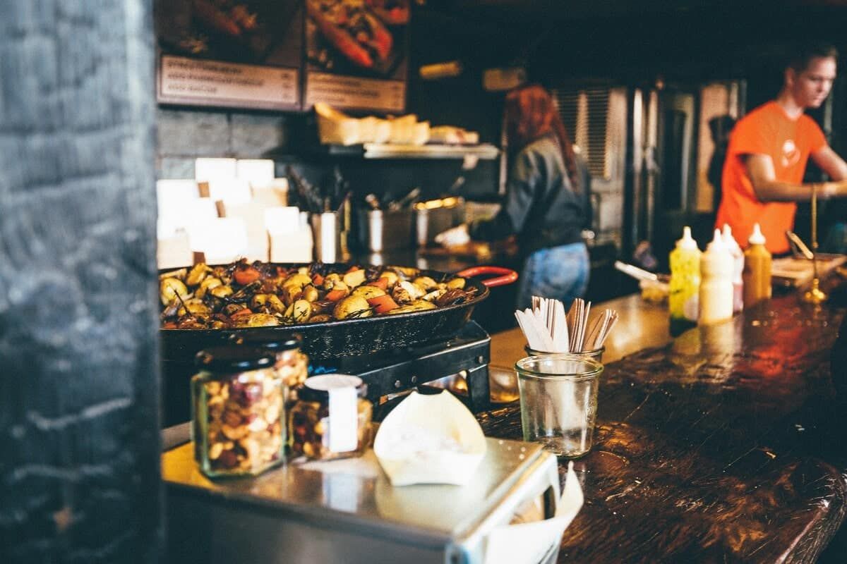 People cooking in a food stall