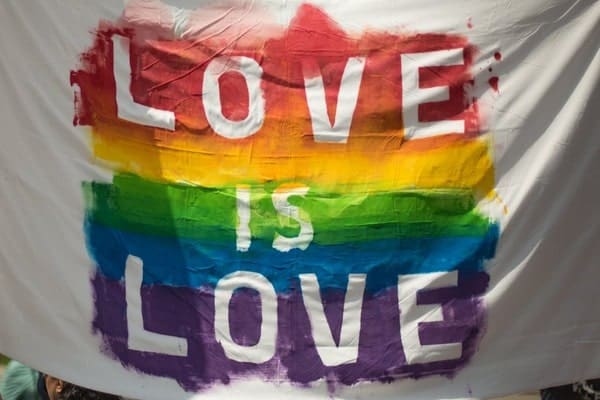 Pride flag with "Love is Love"