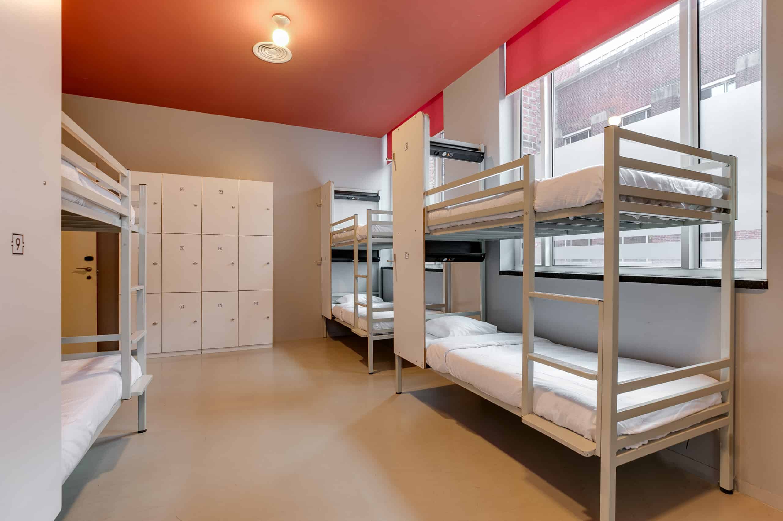 Dorm room with bunk beds and lockers at Clinknoord hostel Amsterdam