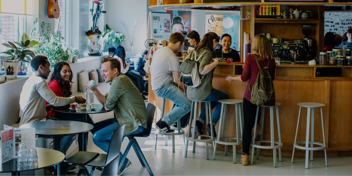 guests socialising at Clinknoord hostel in amsterdam