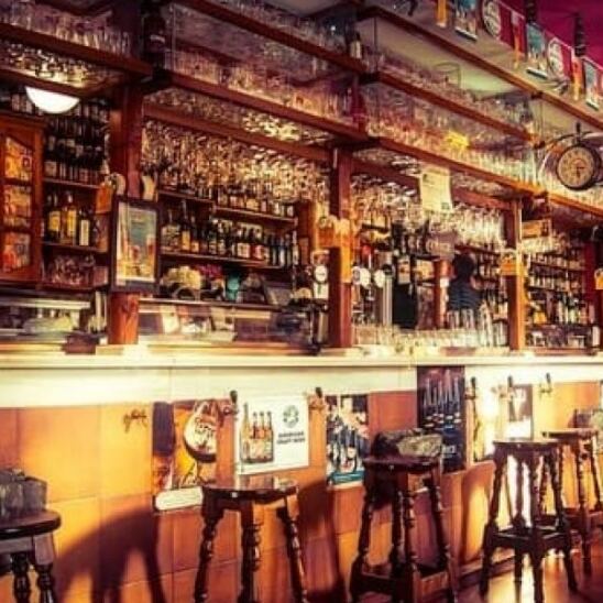 Bar with alcohol stacked on shelves