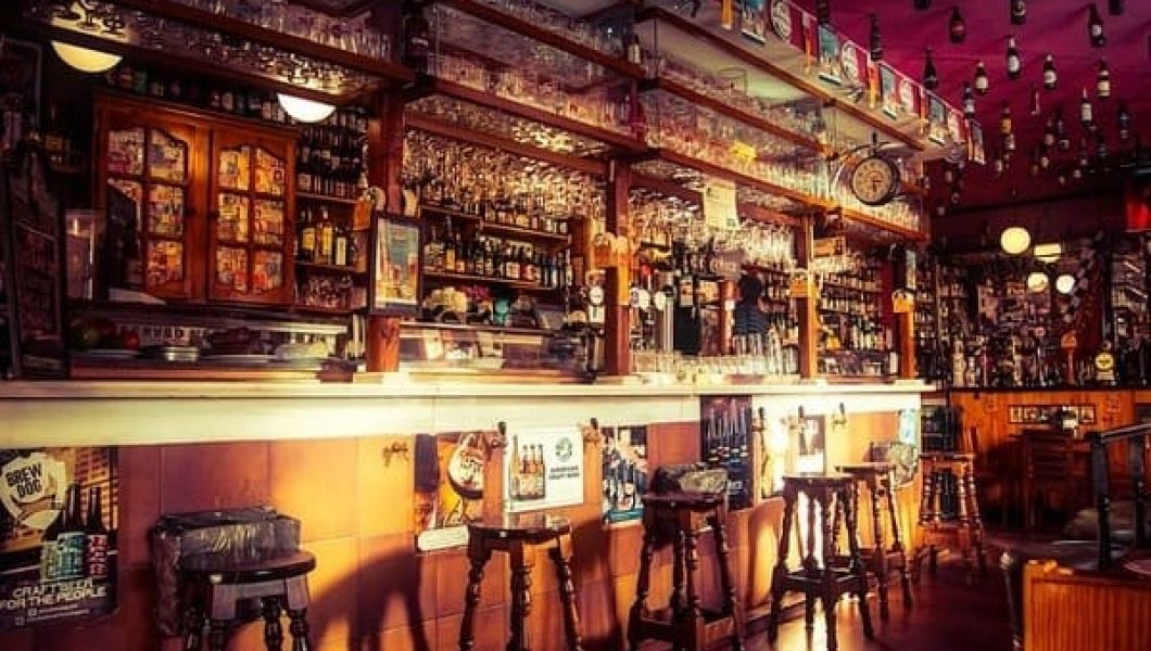 Bar with alcohol stacked on shelves