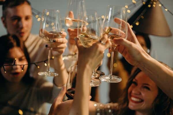 People toasting with drinks