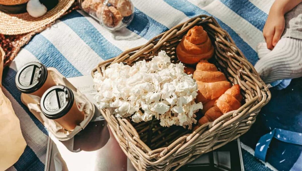 Snacks on a picnic blanket.