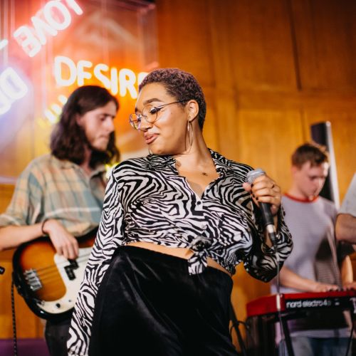 Musicians playing at CLINK hostels