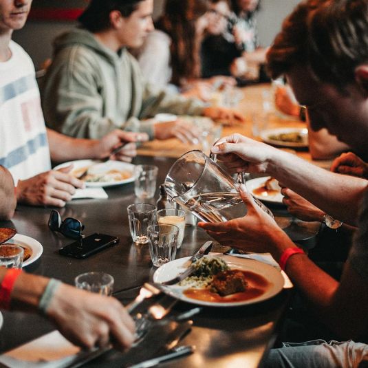 Groups eating together at Clink hostel