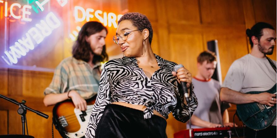 Musicians playing at CLINK hostels