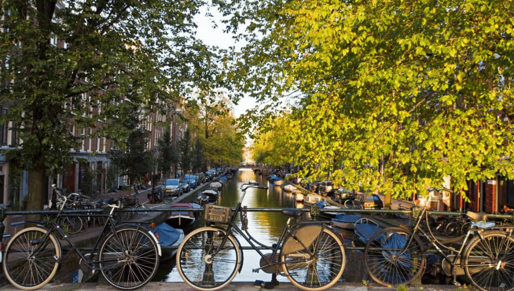 Row of bikes overlooking Amsterdam canal