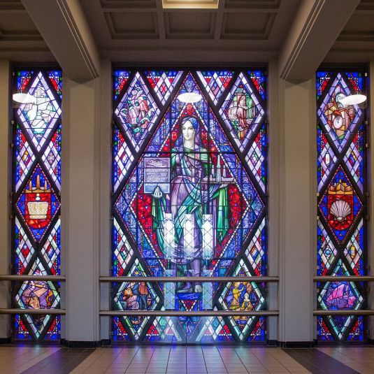 an artistic stained glass window at ClinkNOORD hostel in Amsterdam