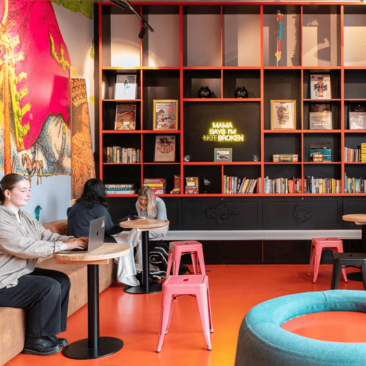 People relaxing in Dublin hostel communal area
