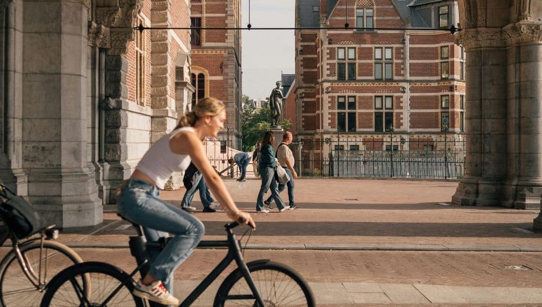 a tourist on a bike in amsterdam